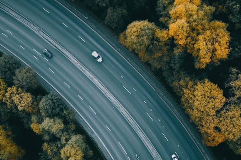 An aerial view of a motorway in England in the concept of 'can you use a man and van service for long distance moves'.