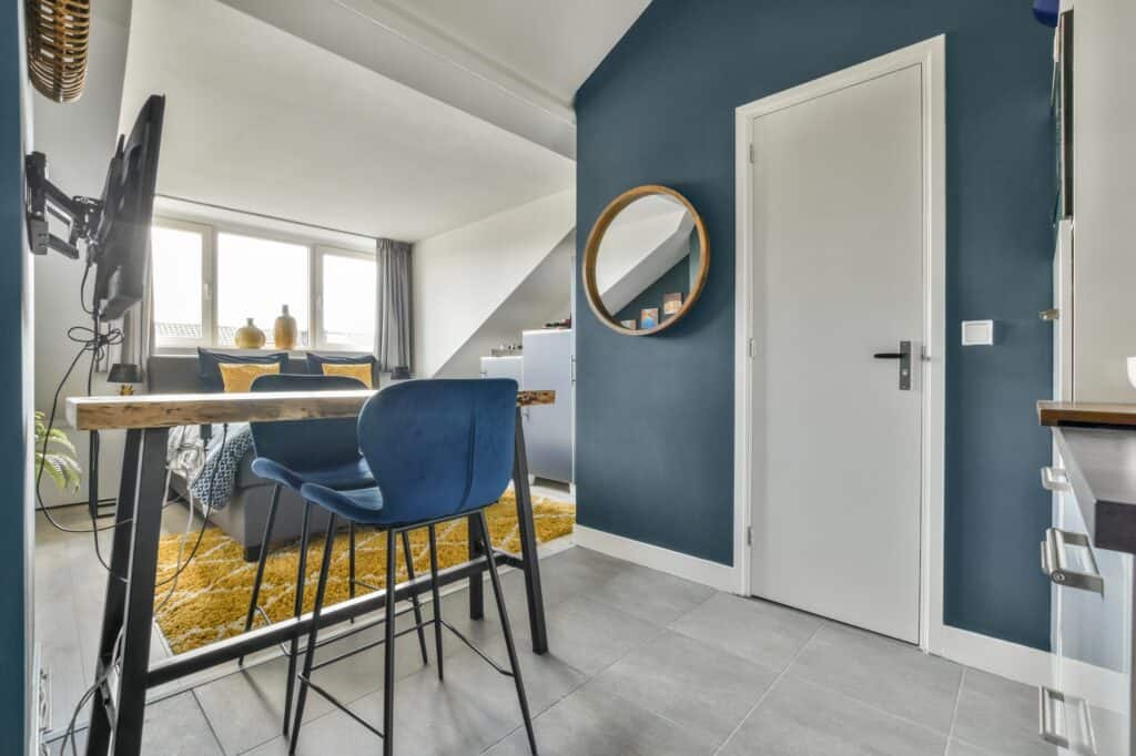 A small studio flat with furniture and fixtures in the concept of 'what factors influence the cost of a man and van service'.