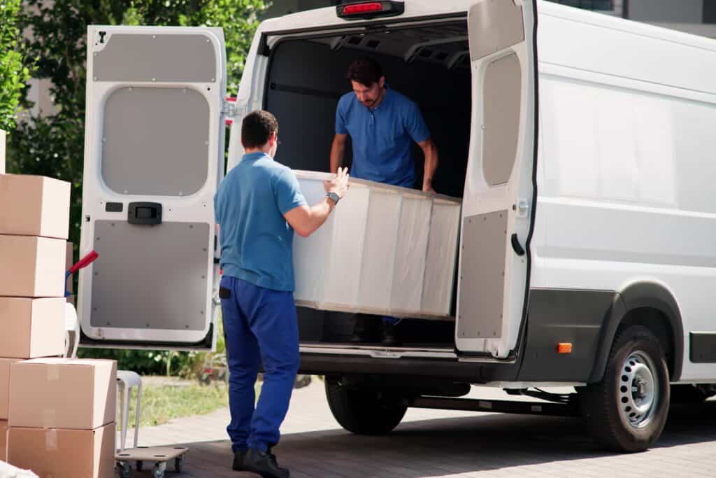 Man and van crew loading furnitures and boxes into the van